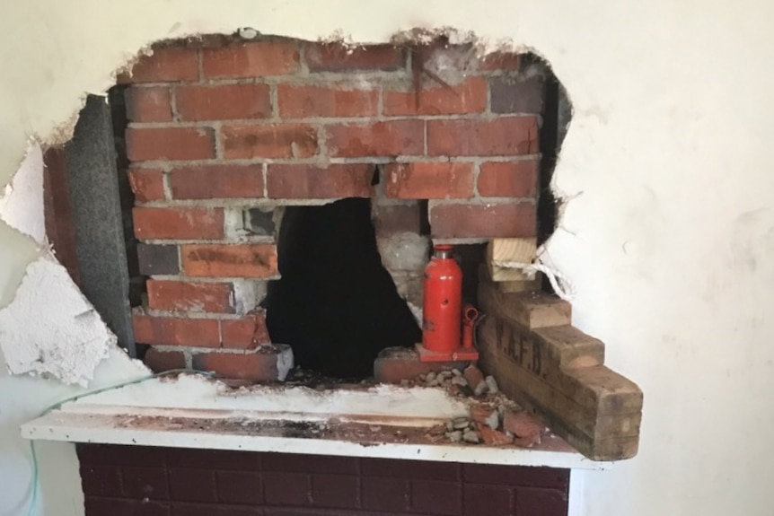 The hole in the wall and chimney after emergency workers removed the boy.