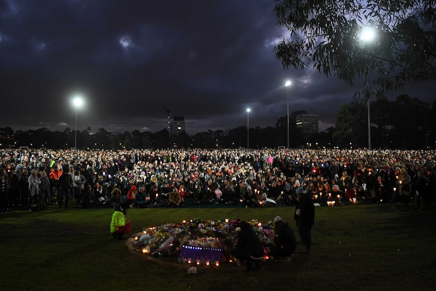 Thousands of people gather at sundown for the Reclaim Princess Park Vigil in Melbourne.