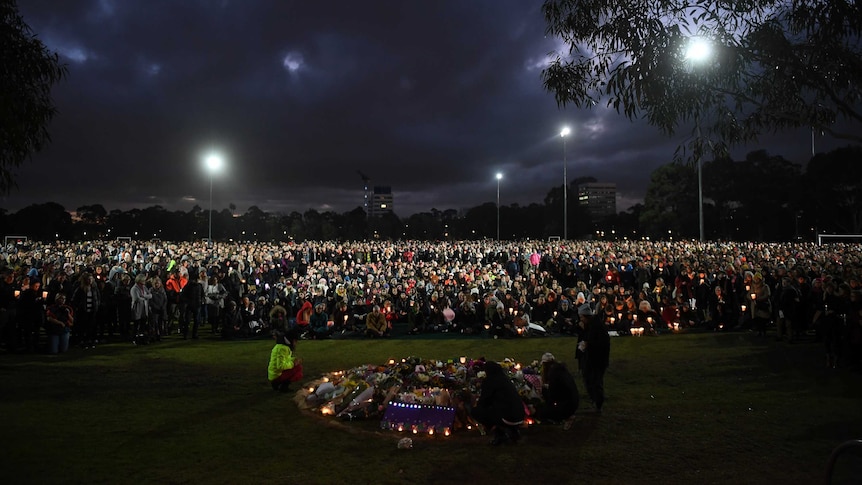 Thousands of people gather at sundown for the Reclaim Princess Park Vigil in Melbourne.