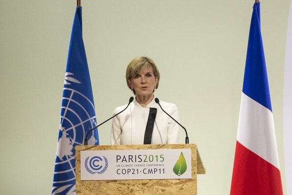 Julie Bishop standing at a podium delivering a speech in Paris.