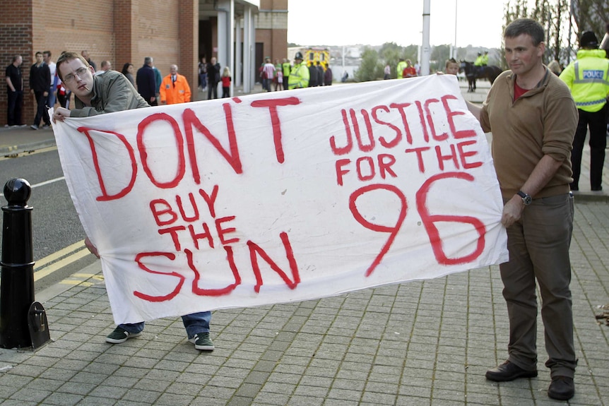 Liverpool supporters display a banner in support of the victims of the Hillsborough Stadium disaster.