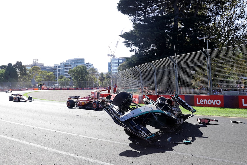 George Russell's Mercedes car on its side after a crash in the Australian Grand Prix