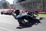 George Russell's Mercedes car on its side after a crash in the Australian Grand Prix