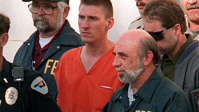 Oklahoma Bomber Timothy McVeigh being led from the Noble County Courthouse in Oklahoma by FBI agents