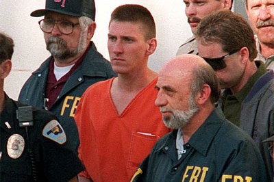 Oklahoma Bomber Timothy McVeigh being led from the Noble County Courthouse in Oklahoma by FBI agents