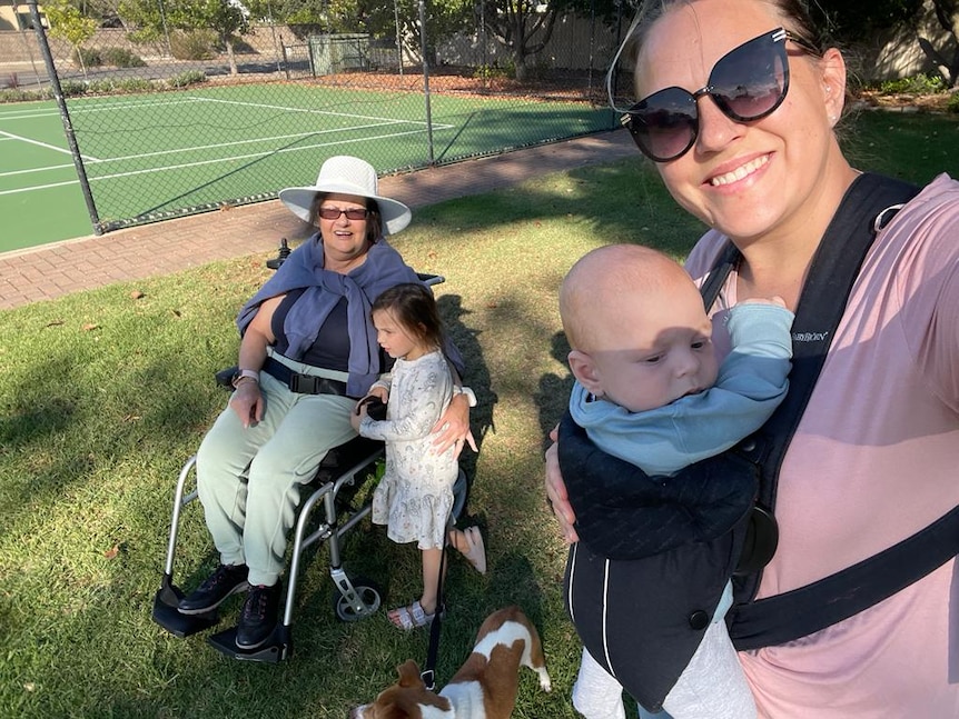 Ronda, her daughter Rebecca, and her grandkids take a stroll in the park.