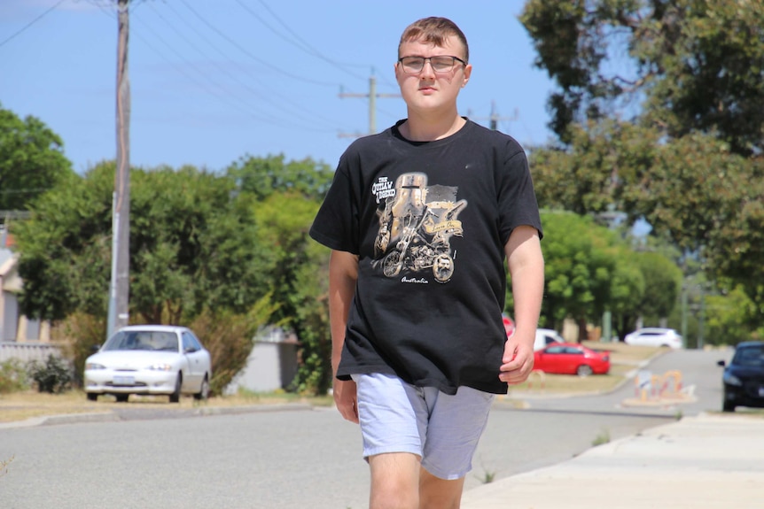 Jake Butcher walks along a footpath after undergoing weight loss surgery.