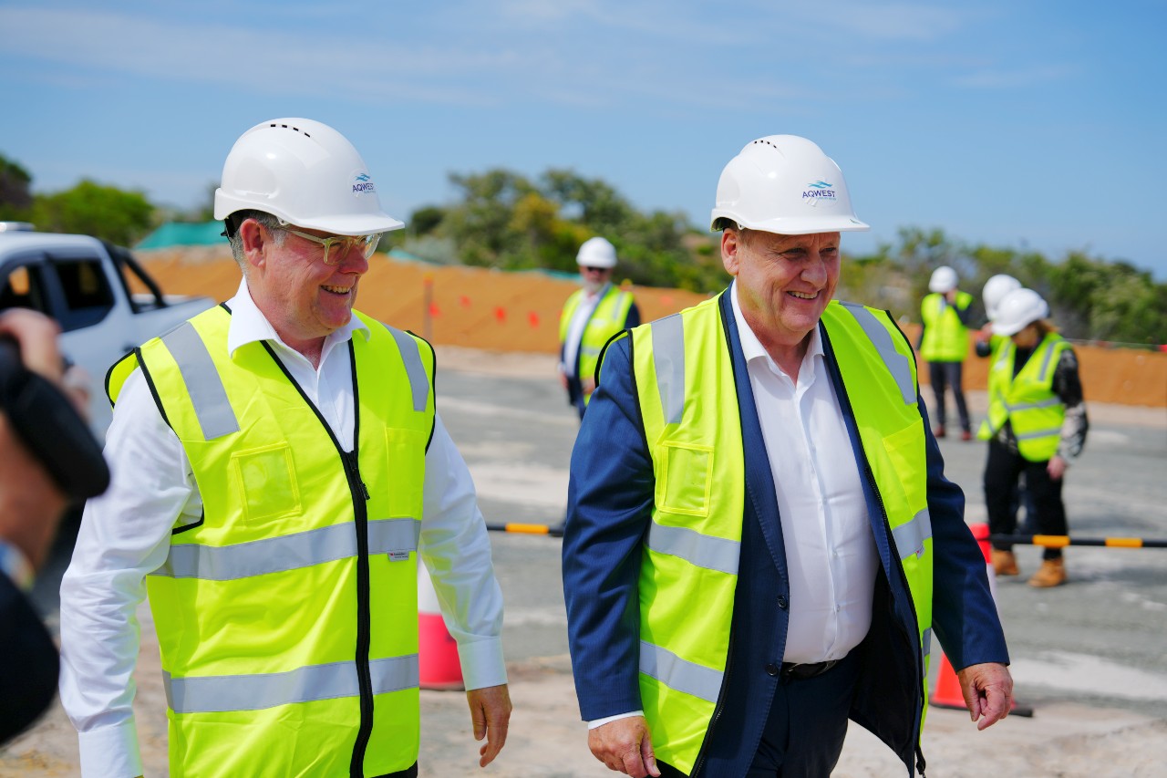 Murray Watt and Don Punch walk next to each other wearing high vis