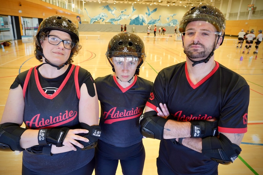 Three roller derby players take a break from training in preparation for the national titles.
