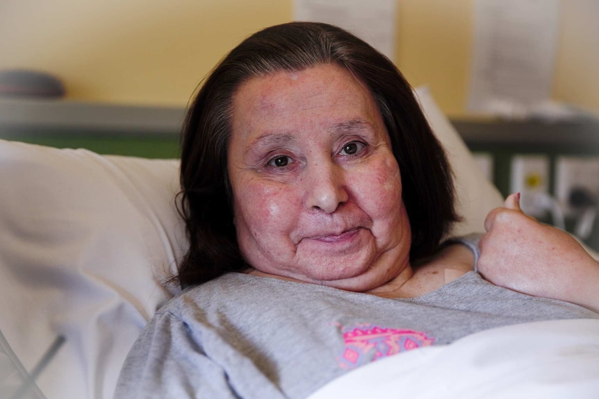 Angelina Giorgio looks into the camera from her nursing home bed in Canberra.