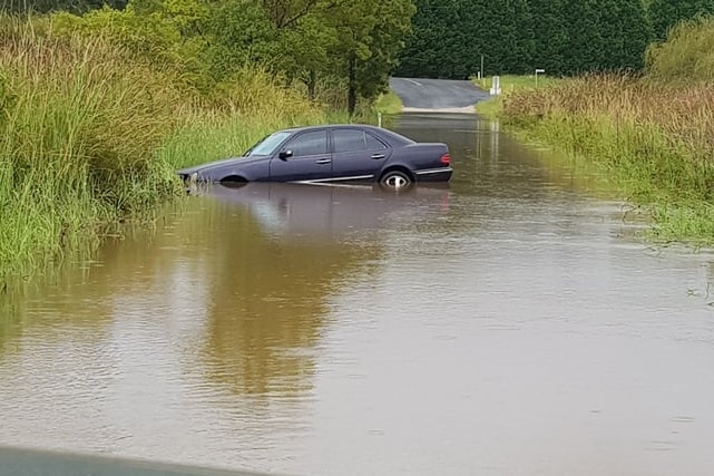 A car stuck in flooded waters
