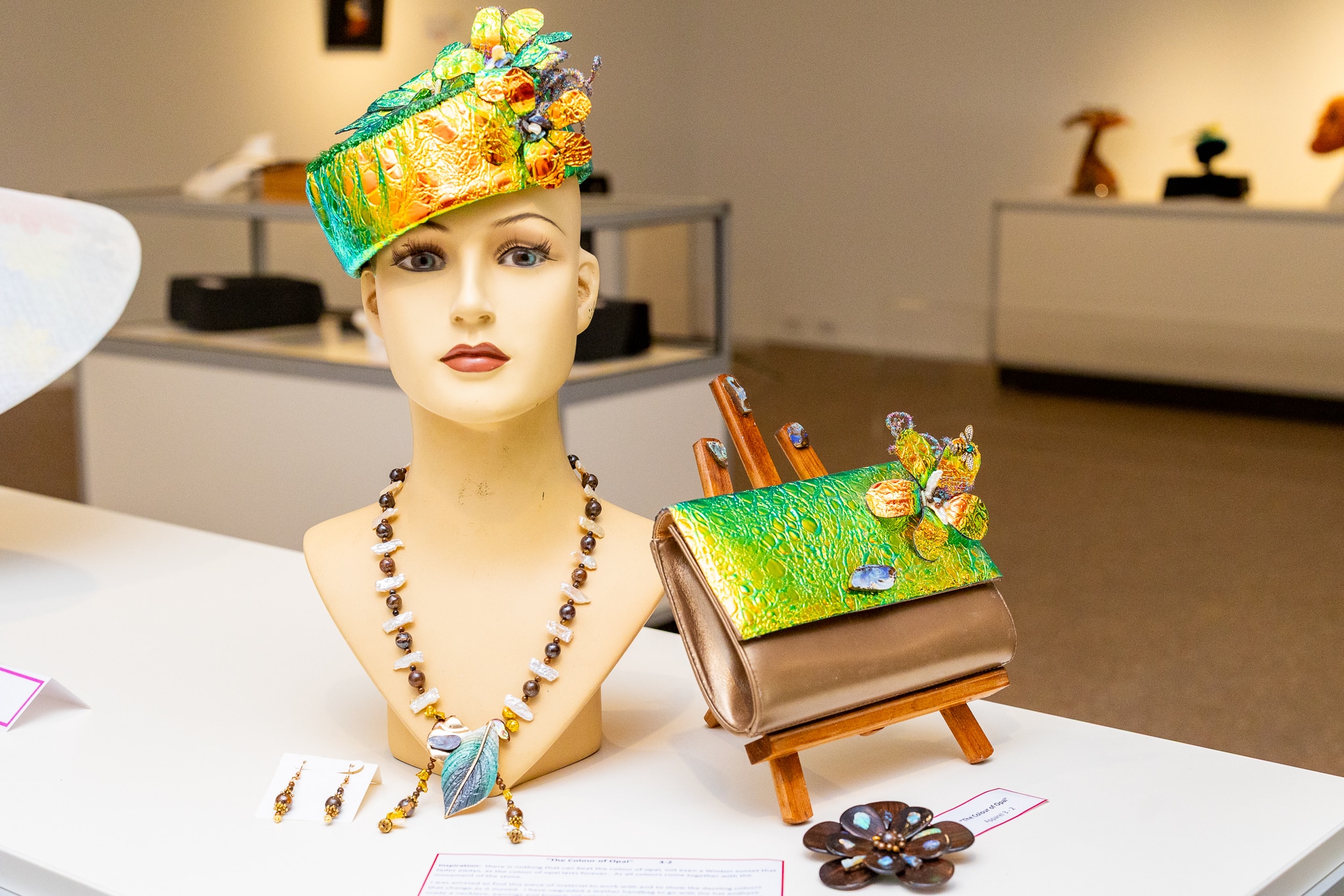 A mannequin bust adorned with jewellery.