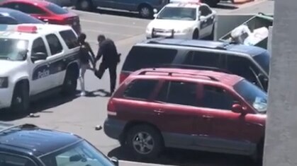 Screenshot shows police arresting man in carpark