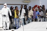 Thousands more migrants call for help in Mediterranean sea as international rescue effort gets underway