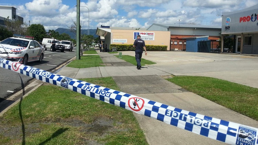 Police said the man's body was found on the footpath outside this Cairns business