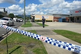 Police said the man's body was found on the footpath outside this Cairns business