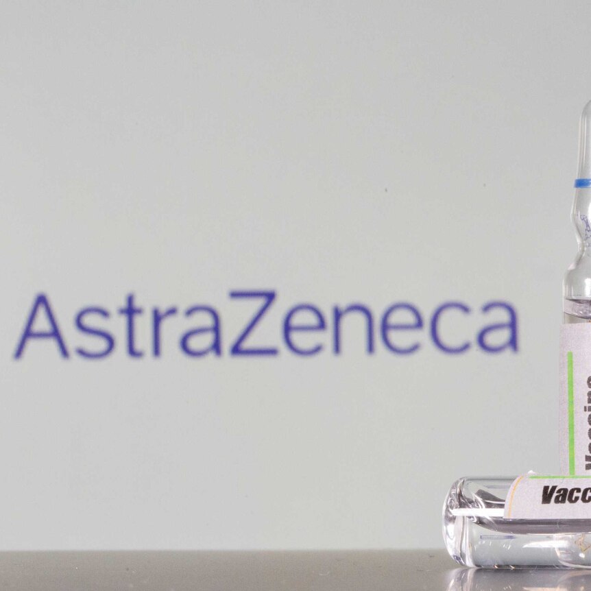 A AstraZeneca logo sits behind vials of generic vaccine.