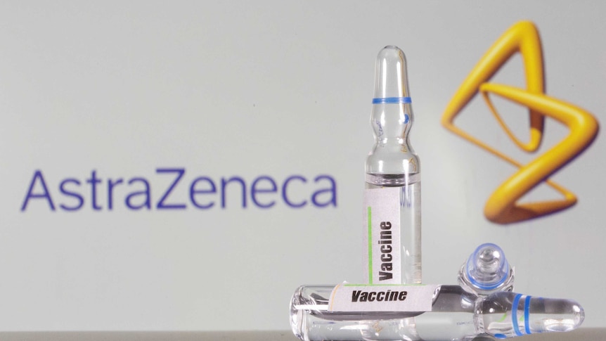 An AstraZeneca logo sits behind vials of generic vaccine.