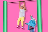 Small child reaches for the monkey bar above her, where another child swings happily to depict when to send kids to school