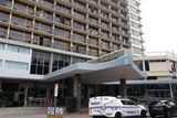 A police van parked outside the Pacific Hotel in Cairns.