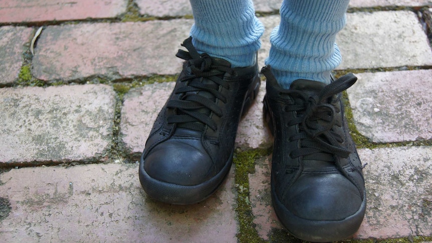 A student wearing school shoes.