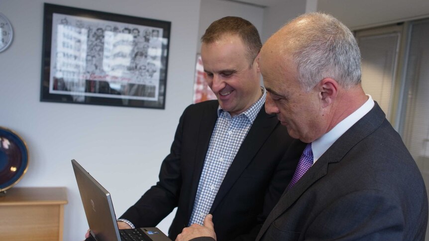 Andrew Barr and James Falzon from Reuse-RecycleIT discuss recycling Mr Barr's aging laptop