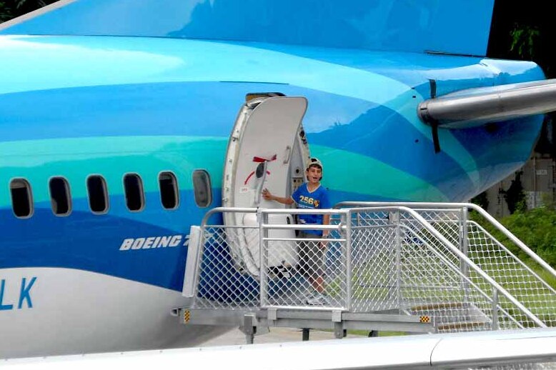 Amir boarding plane in Nauru