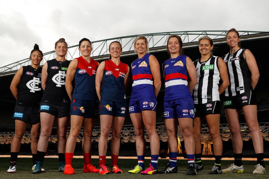 Darcy Vescio stands with the inauguaral group of eight AFLW marquee players on the MCG field in 2016