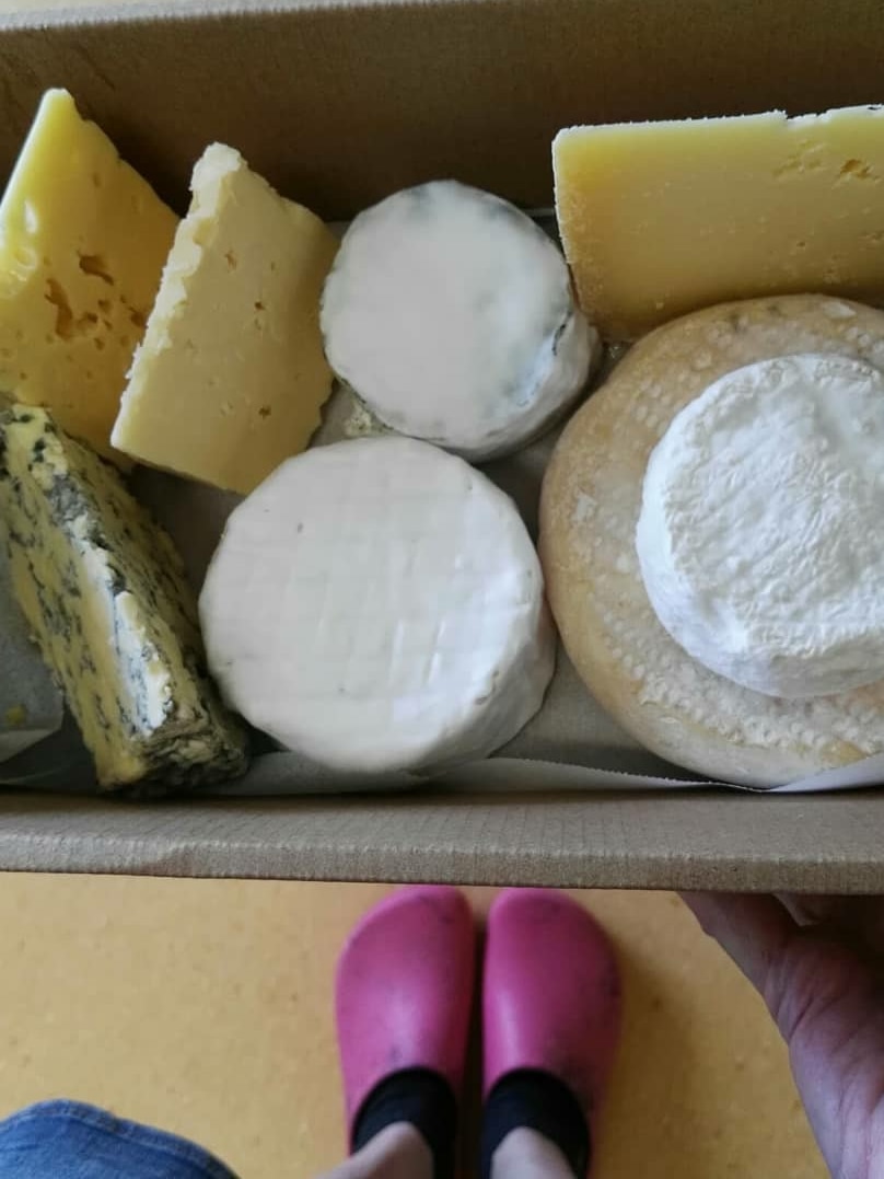 A box of artisan cheeses.