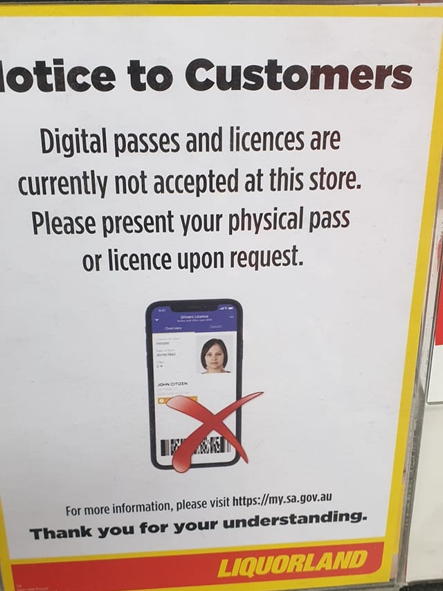 A notice at an Adelaide bottle shop advising patrons the new digital licences are not a valid form of ID.