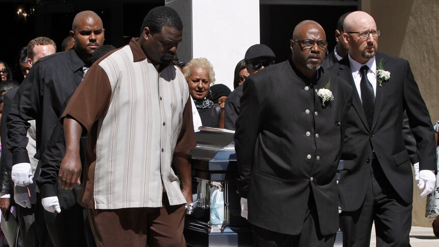 Pallbearers carry the casket from Rodney King's memorial service.