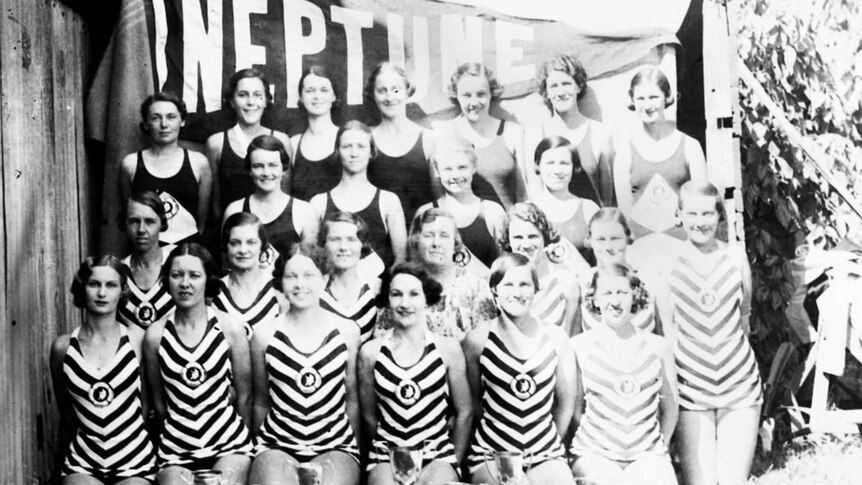 Women standing in bathing suits for a group photo in 1935.