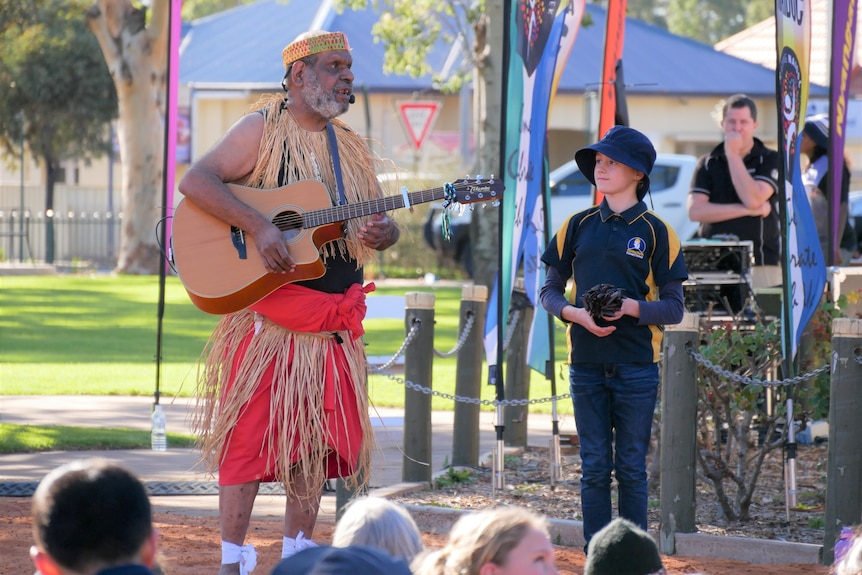 Torres Strait Islander Elder Eddie Peters performing with a student at NAIDOC Week in Port Augusta.