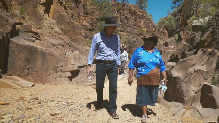 Picture of Rev Denise Champion walking in her country with Dr Stuart Macmillan