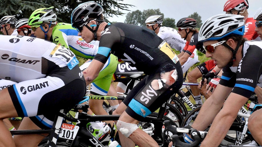 British rider Chris Froome rides injured after falling during the Tour de France in July 2014.