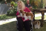 Disability care recipient Ann Marie Smith with her two dogs.