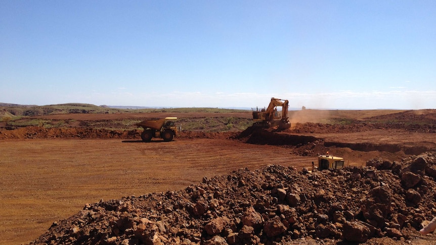 Tractors are seen in operation at the Atlas Iron mine in the Pilbara