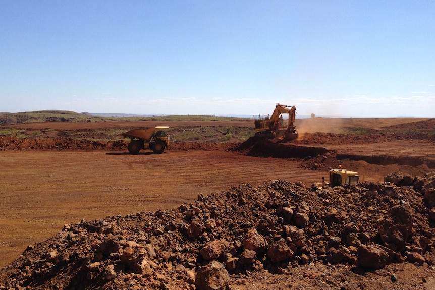 Tractors are seen in operation at a mine in the Pilbara