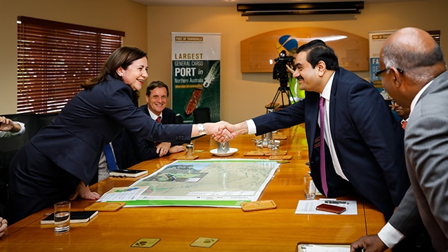 Queensland Premier Annastacia Palaszczuk shakes hands with Adani Group chairman Gautam Adani in Townsville on December 6, 2016.
