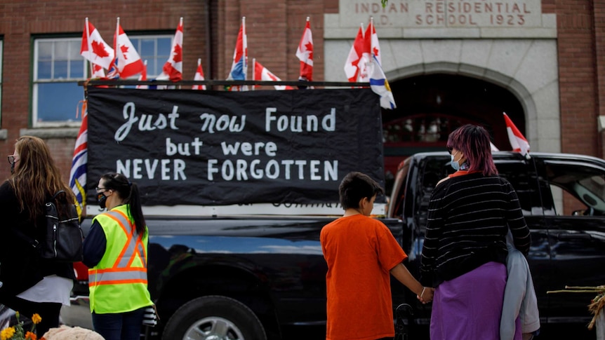 People former Kamloops Indian Residential School after the remains of 215 children were found.