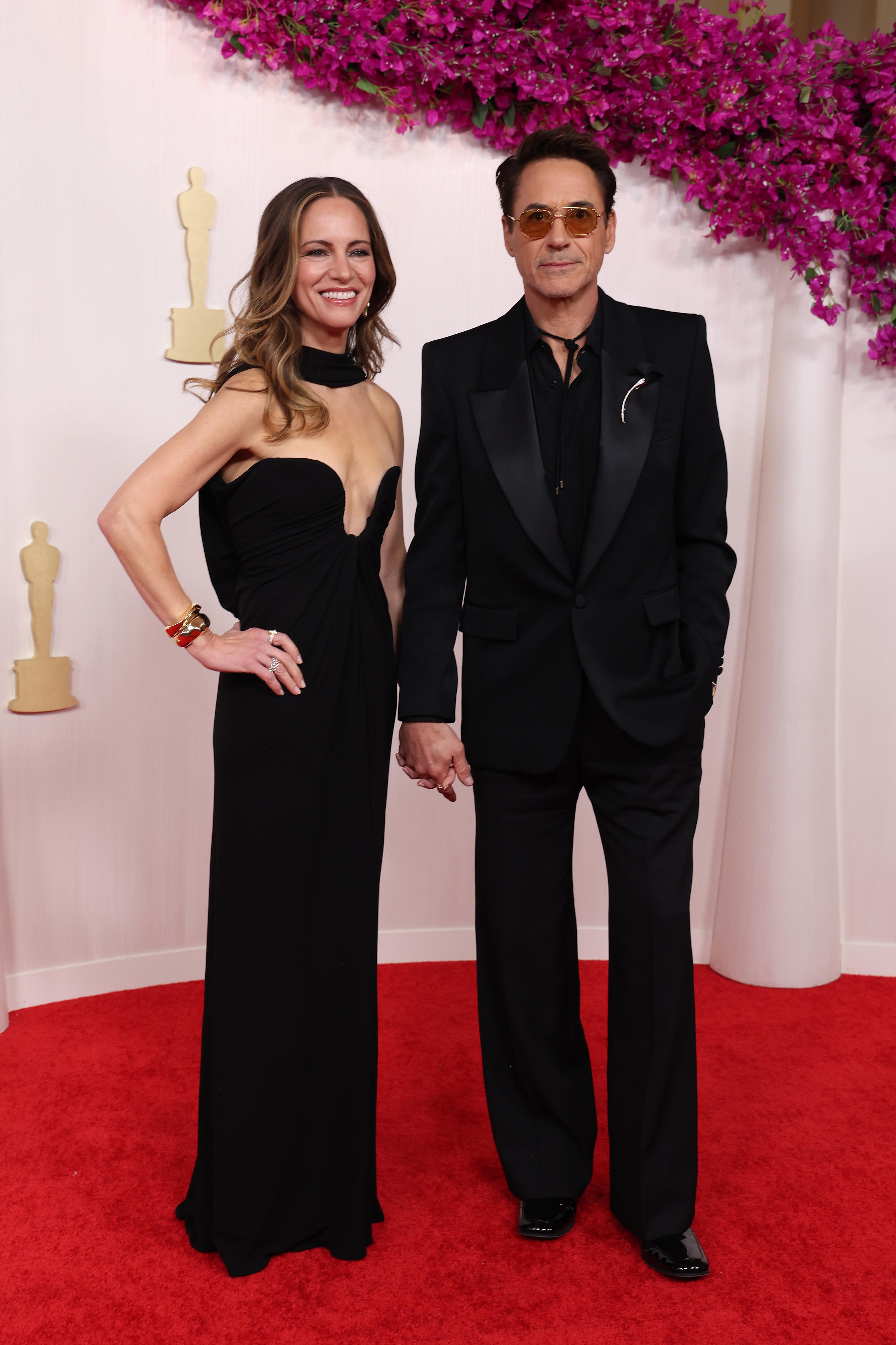 Susan Downey and Robert Downey Jr both wearing black on the Oscars red carpet
