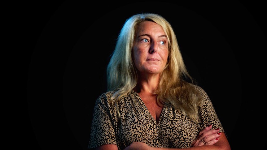 Nicola Gobbo, known as Lawyer X, wearing a leopard print dress stares into the distance.
