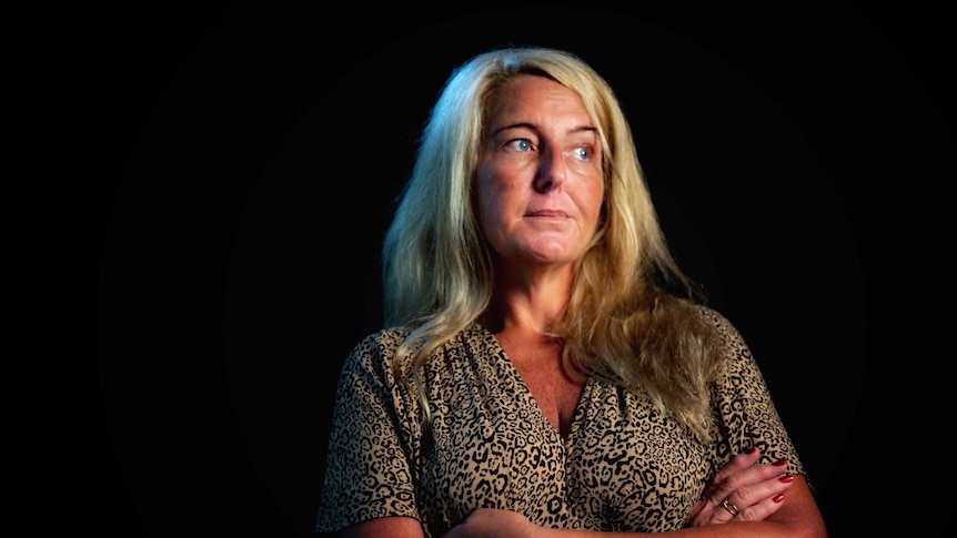 Nicola Gobbo, known as Lawyer X, wearing a leopard print dress stares into the distance.