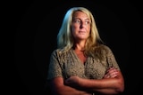 Nicola Gobbo, known as Lawyer X, wearing a leopard print dress stares into the distance.