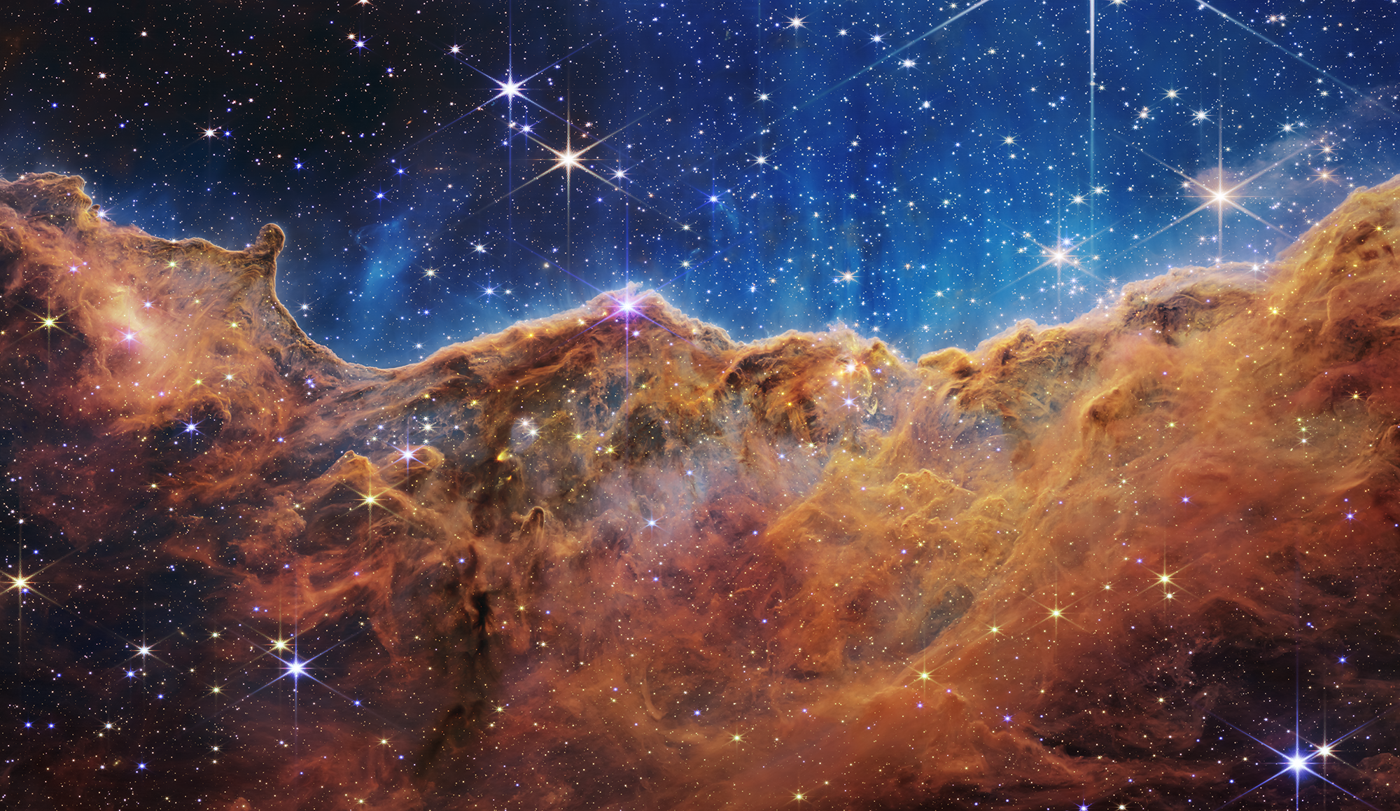 The image looks like a landscape of mountains and valleys with stars in the sky.