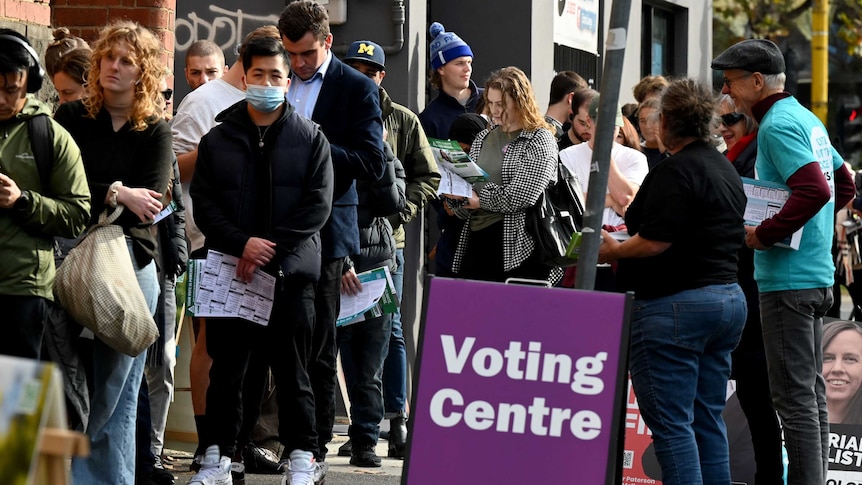 People queue outside a pre-polling centre in Melbourne.