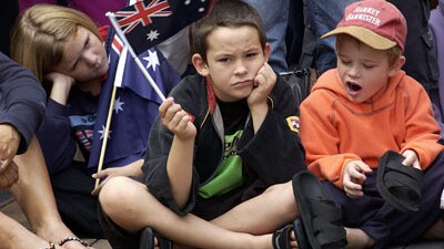 Bored children at the Brisbane Anzac Day parade (Getty Images)