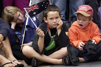 Bored children at the Brisbane Anzac Day parade (Getty Images)