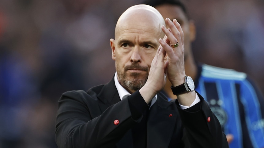 Erik ten Hag claps after an Ajax game.