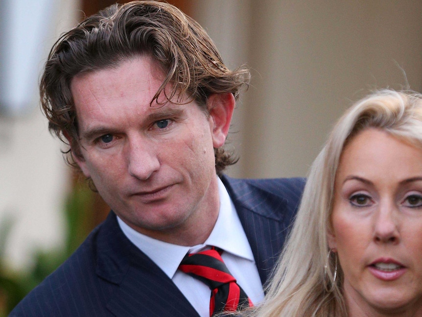 Essendon coach James Hird and his wife Tania leave their house in Toorak, Melbourne in August 2013.